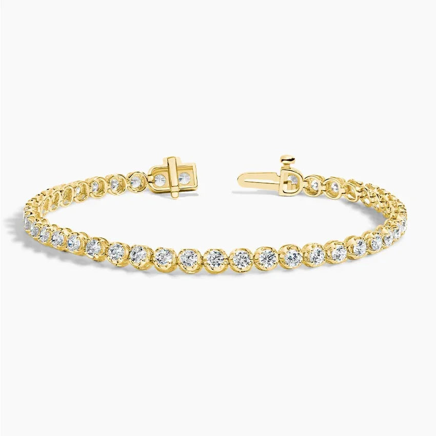 Lab grown diamond tennis bracelet in 14K yellow gold with open clasp on white background