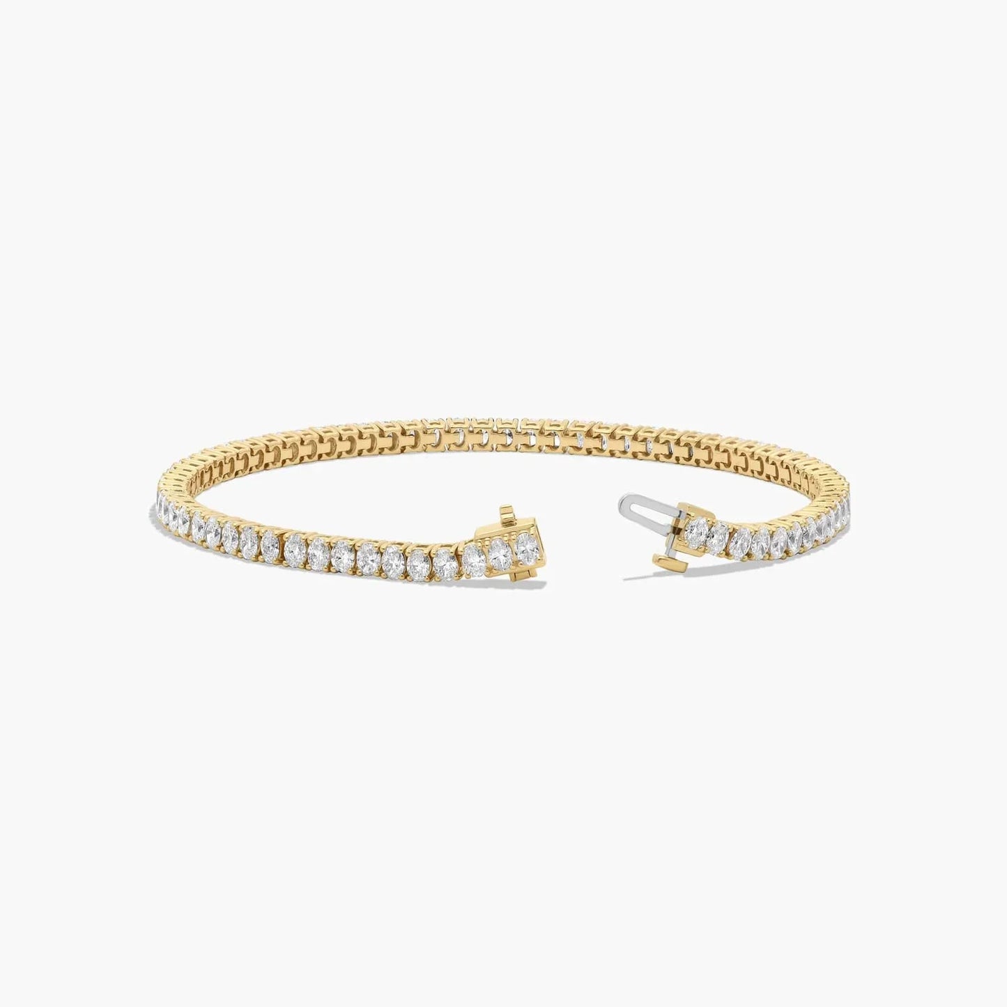7 inch oval cut lab diamond tennis bracelet in 14K yellow gold with open clasp, Delux Jewelry