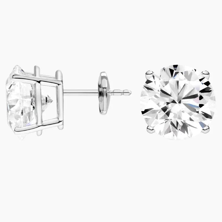 Lab grown diamond stud earrings in 14K white gold from Delux Jewelry on white background.