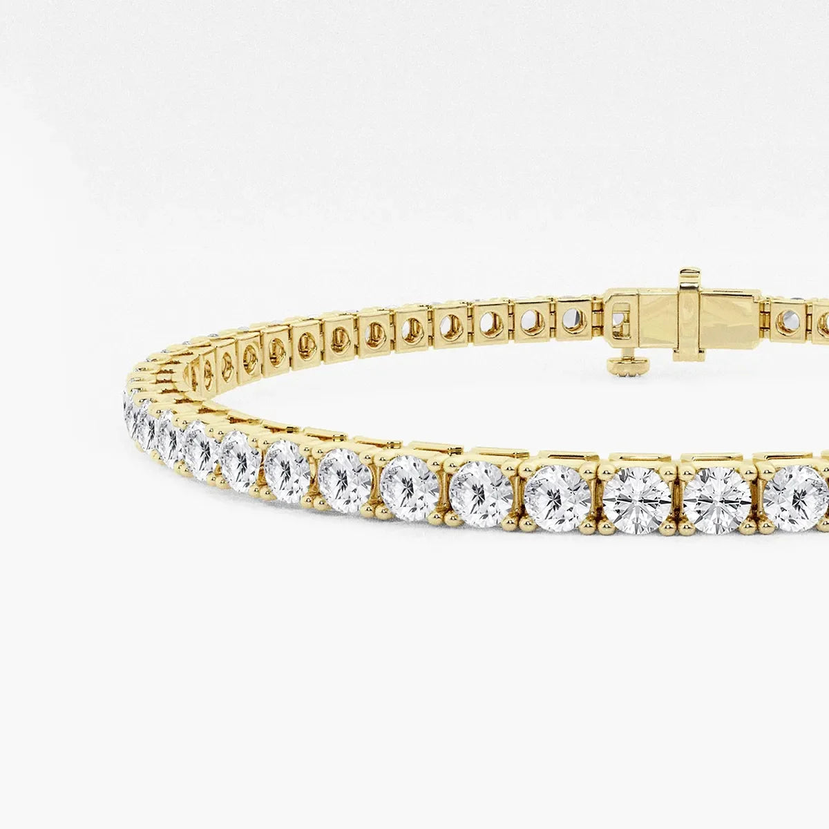Lab grown diamond tennis bracelet in yellow gold by Delux Jewelry on white background
