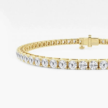 Lab grown diamond tennis bracelet in yellow gold by Delux Jewelry on white background