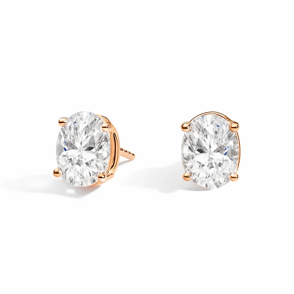 Lab grown diamond stud earrings in gold setting on white background, Delux Jewelry