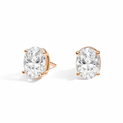 Lab grown diamond stud earrings in gold setting on white background, Delux Jewelry
