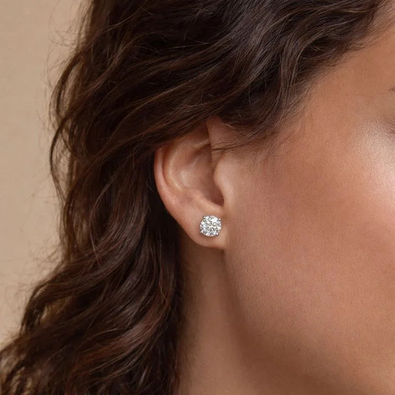Woman wearing a lab grown diamond stud earring from Delux Jewelry