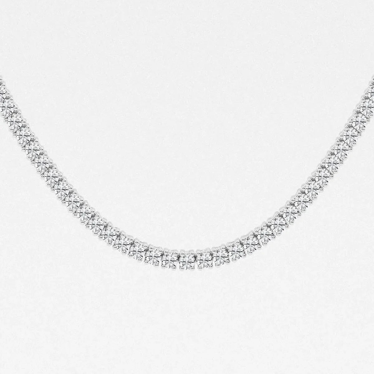 Lab grown diamond tennis chain necklace in sterling silver on white background, Delux Jewelry