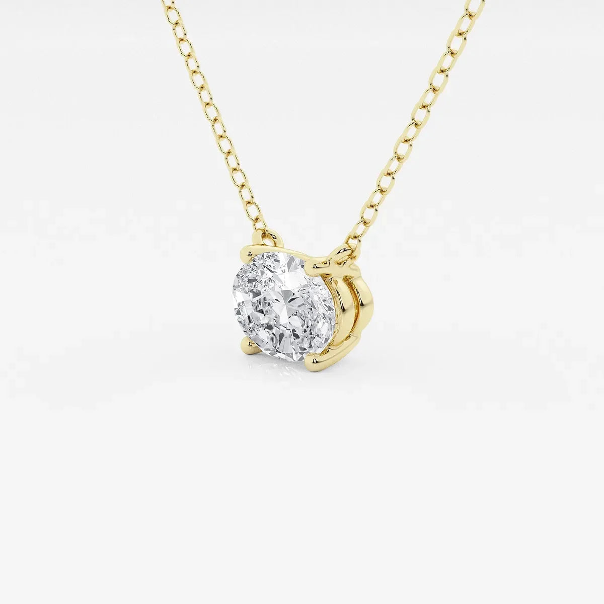 Oval lab grown diamond pendant on yellow gold chain by Delux Jewelry