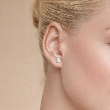 Woman wearing a lab grown diamond stud earring from Delux Jewelry