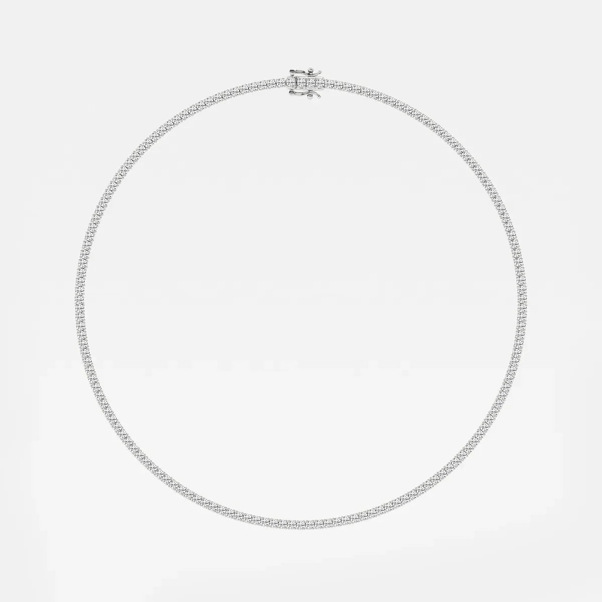 Sterling silver tennis chain with lab grown diamonds on white background, Delux Jewelry