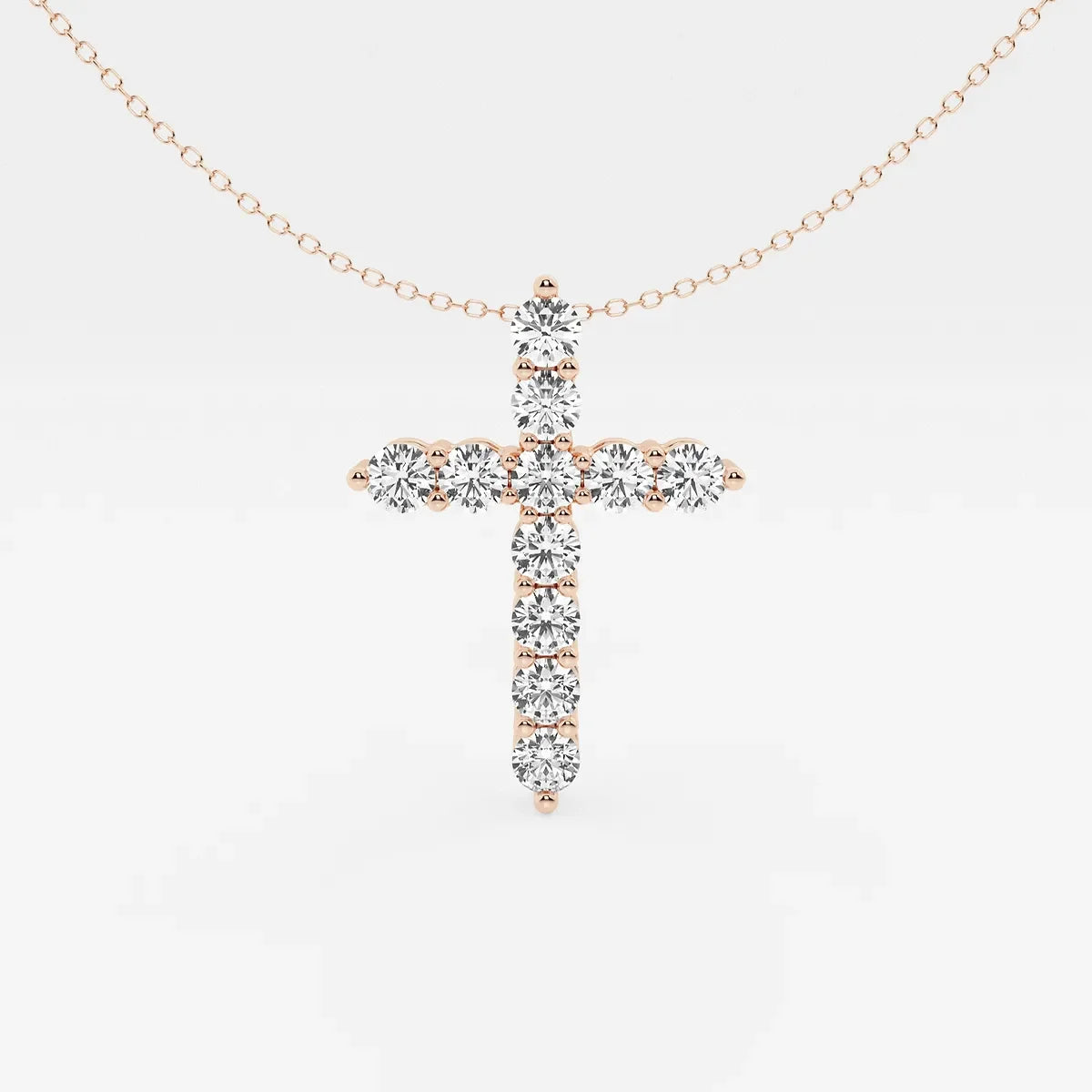 Rose gold lab grown diamond cross pendant necklace by Delux Jewelry on white background