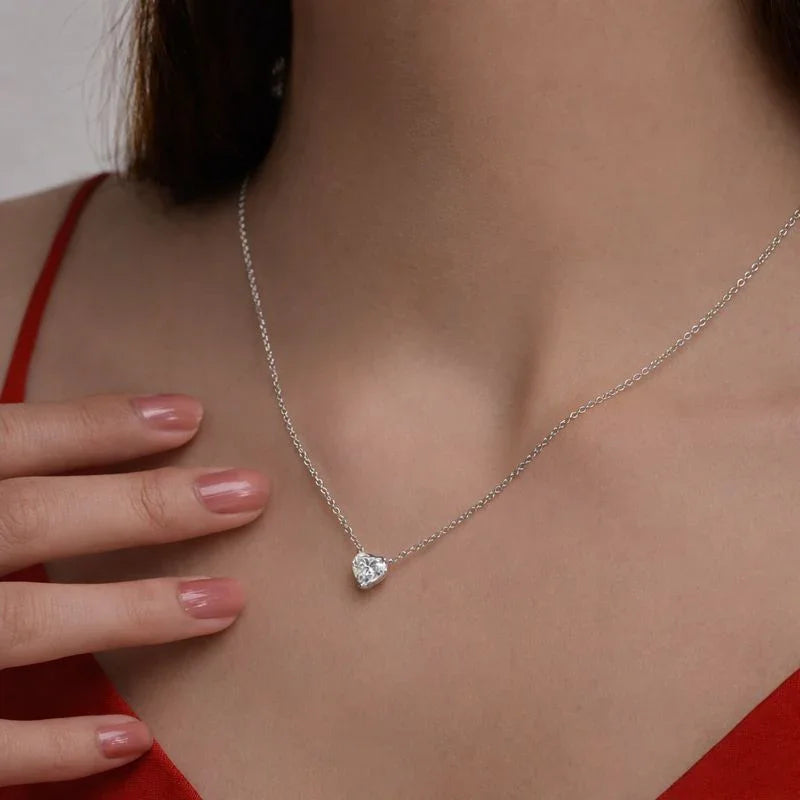 Woman wearing Delux Jewelry heart-shaped lab grown diamond pendant necklace