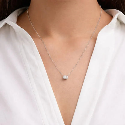 Woman wearing delicate lab grown diamond oval pendant necklace by Delux Jewelry