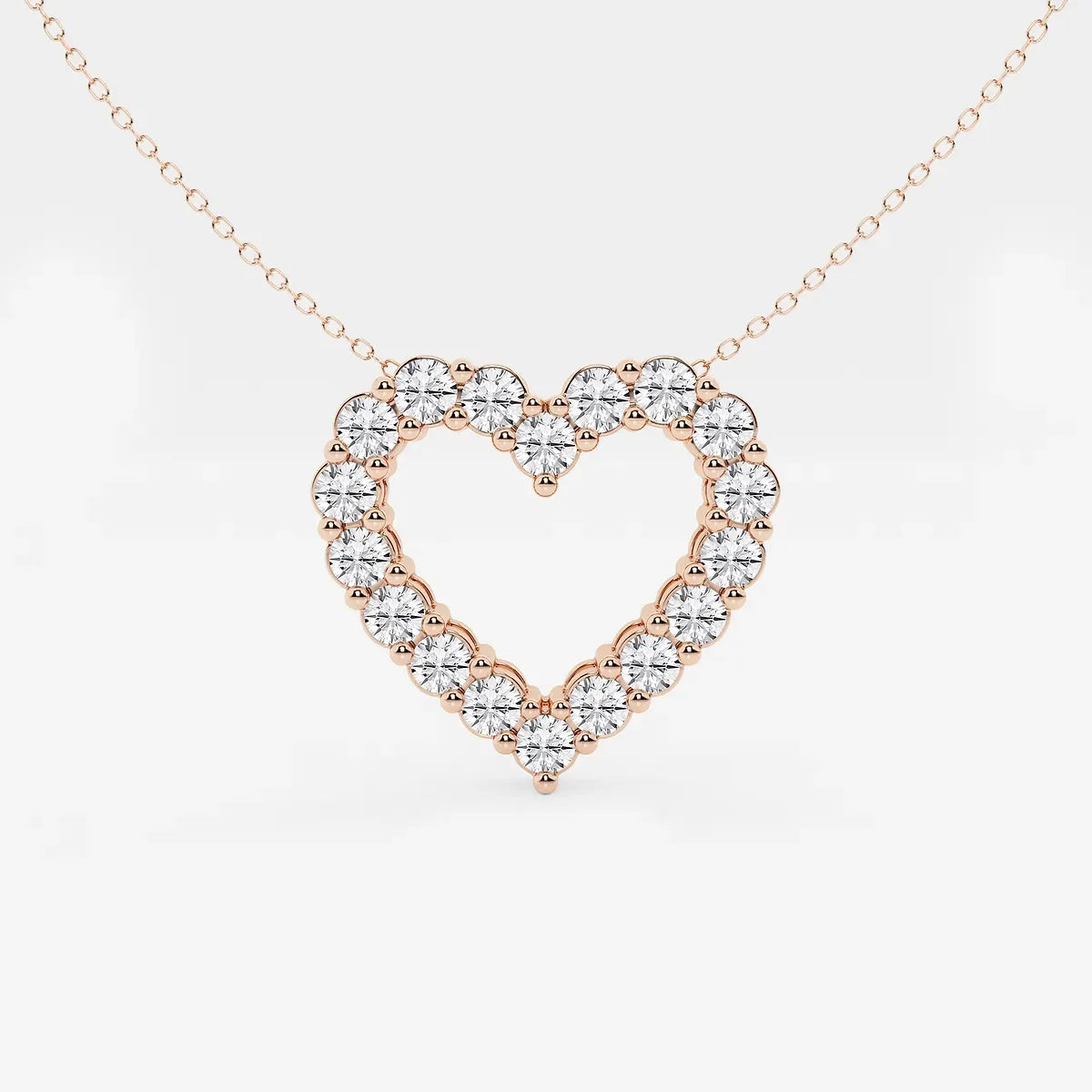 Rose gold heart outline pendant with lab grown diamonds on a delicate chain by Delux Jewelry
