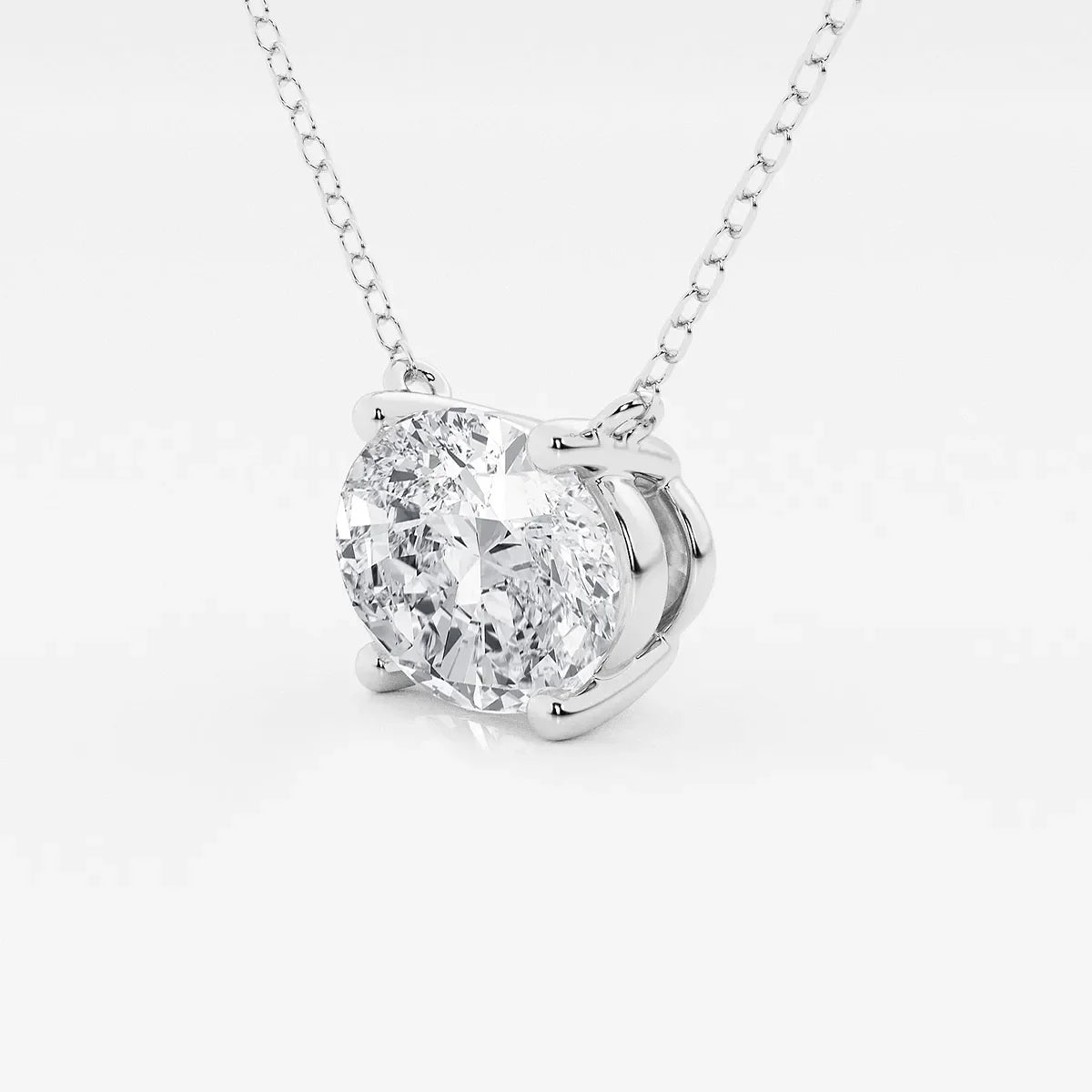 Oval lab grown diamond pendant in white gold on a delicate chain by Delux Jewelry