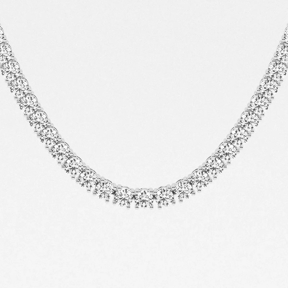 Sterling silver tennis chain with round lab-grown diamonds on white background, Delux Jewelry