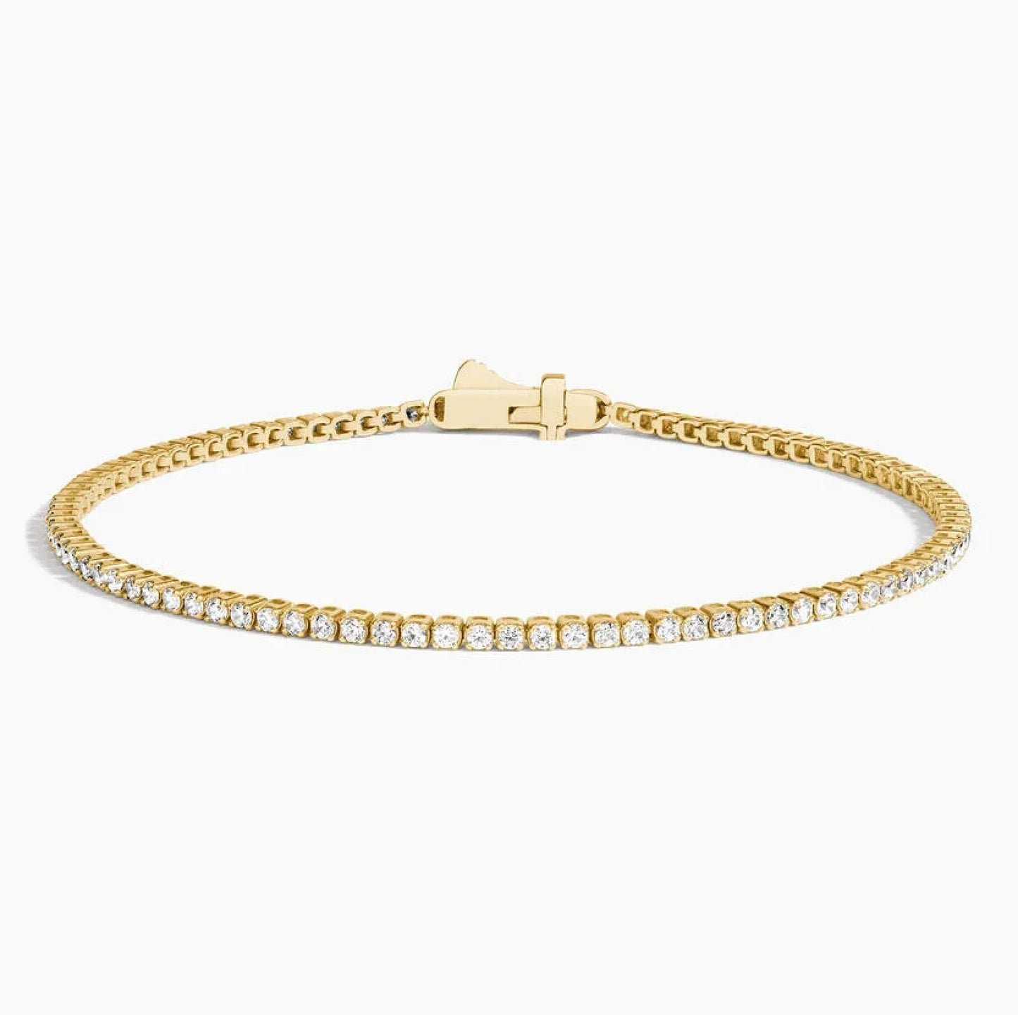 6.5 inch lab grown diamond tennis bracelet in 14K yellow gold with closed clasp on white background