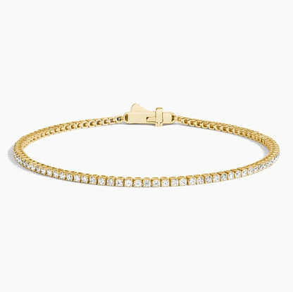 6.5 inch lab grown diamond tennis bracelet in 14K yellow gold with closed clasp on white background