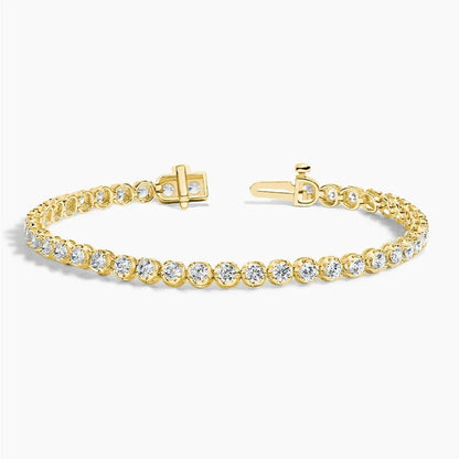 Lab grown diamond tennis bracelet in 14K yellow gold with open clasp on white background