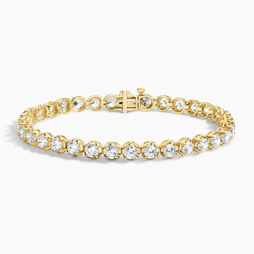 Lab grown diamond tennis bracelet in 14K yellow gold by Delux Jewelry on white background