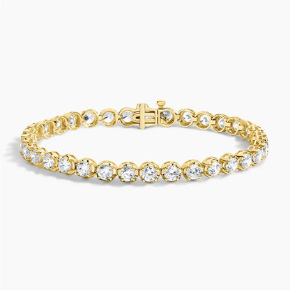 Lab grown diamond tennis bracelet in 14K yellow gold by Delux Jewelry on white background