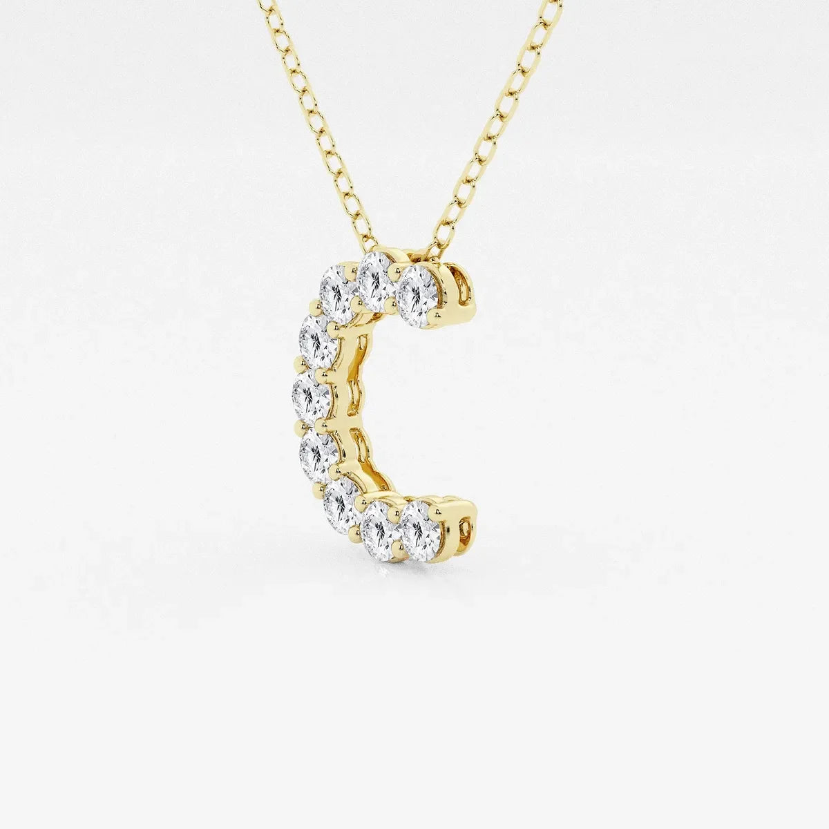 Gold necklace with a C-shaped pendant set with lab grown diamonds from Delux Jewelry
