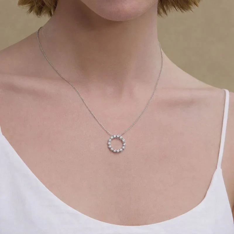 Woman wearing lab grown diamond circle pendant necklace by Delux Jewelry