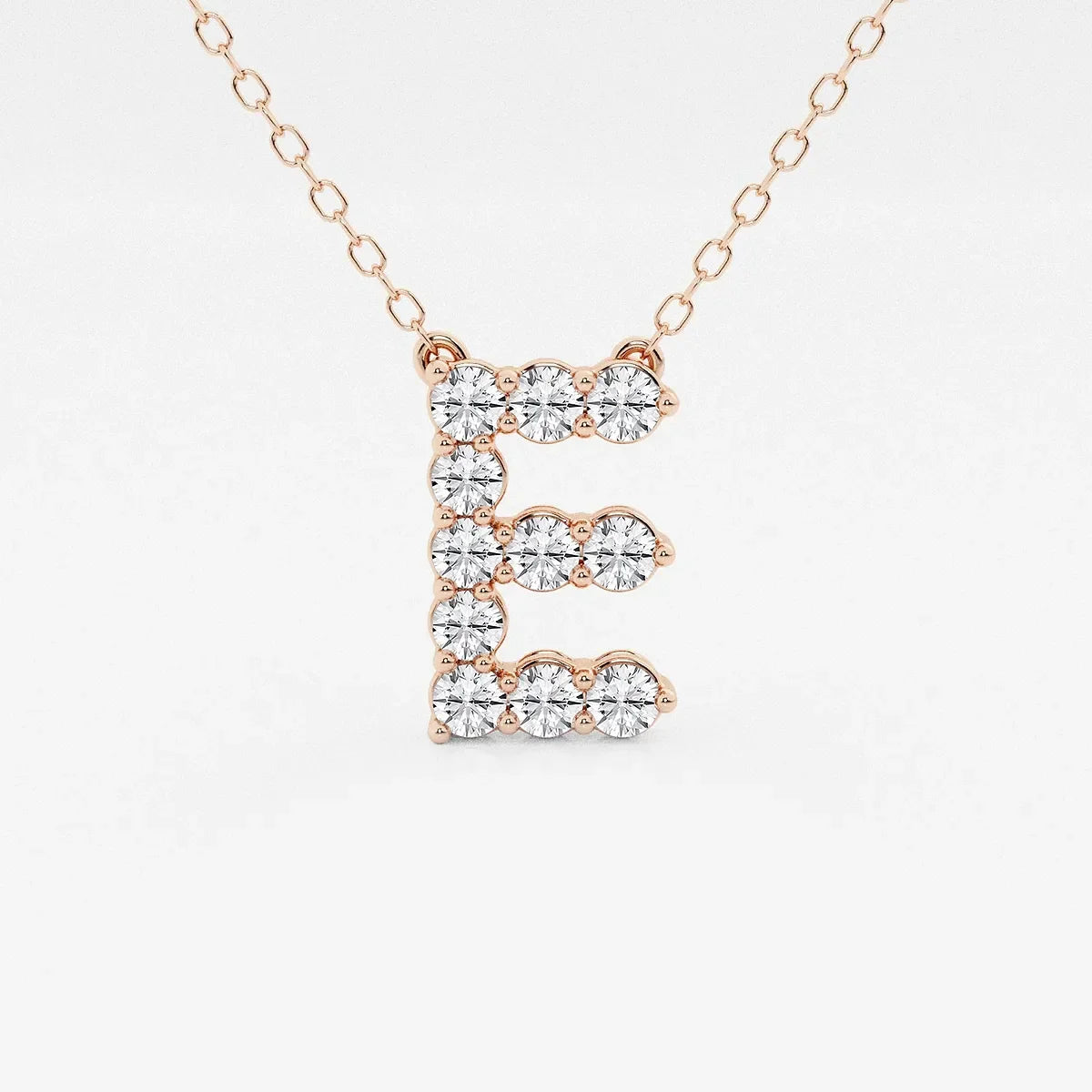 Rose gold pendant necklace with lab grown diamond letter E from Delux Jewelry