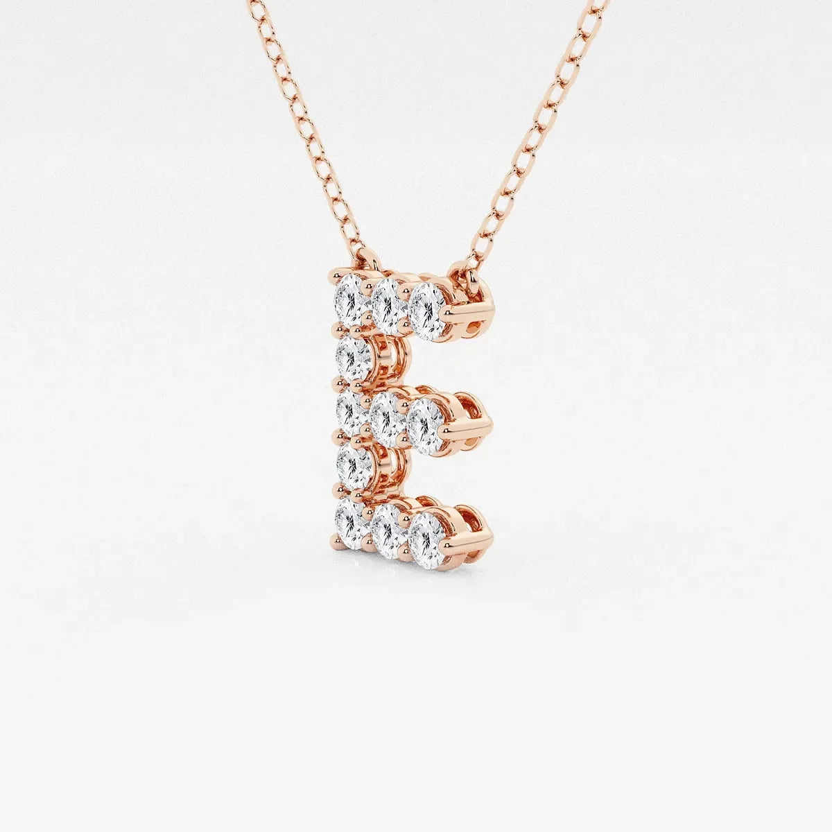 Rose gold pendant necklace with lab grown diamond letter E from Delux Jewelry