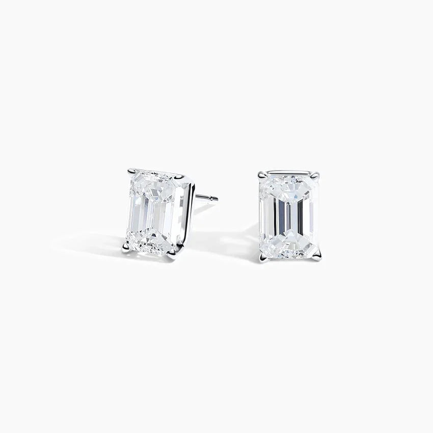 Emerald lab diamond stud earrings in 14K white gold by Delux Jewelry on white background
