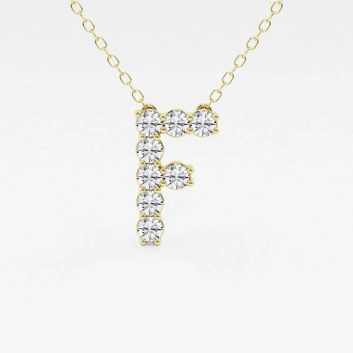 Yellow gold necklace with lab grown diamond letter F pendant from Delux Jewelry