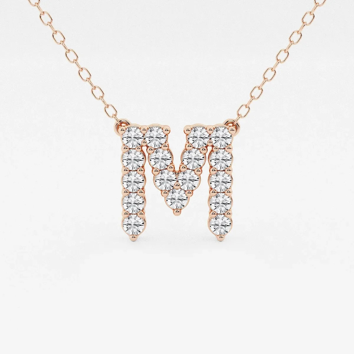 Rose gold necklace with lab grown diamond M initial pendant from Delux Jewelry