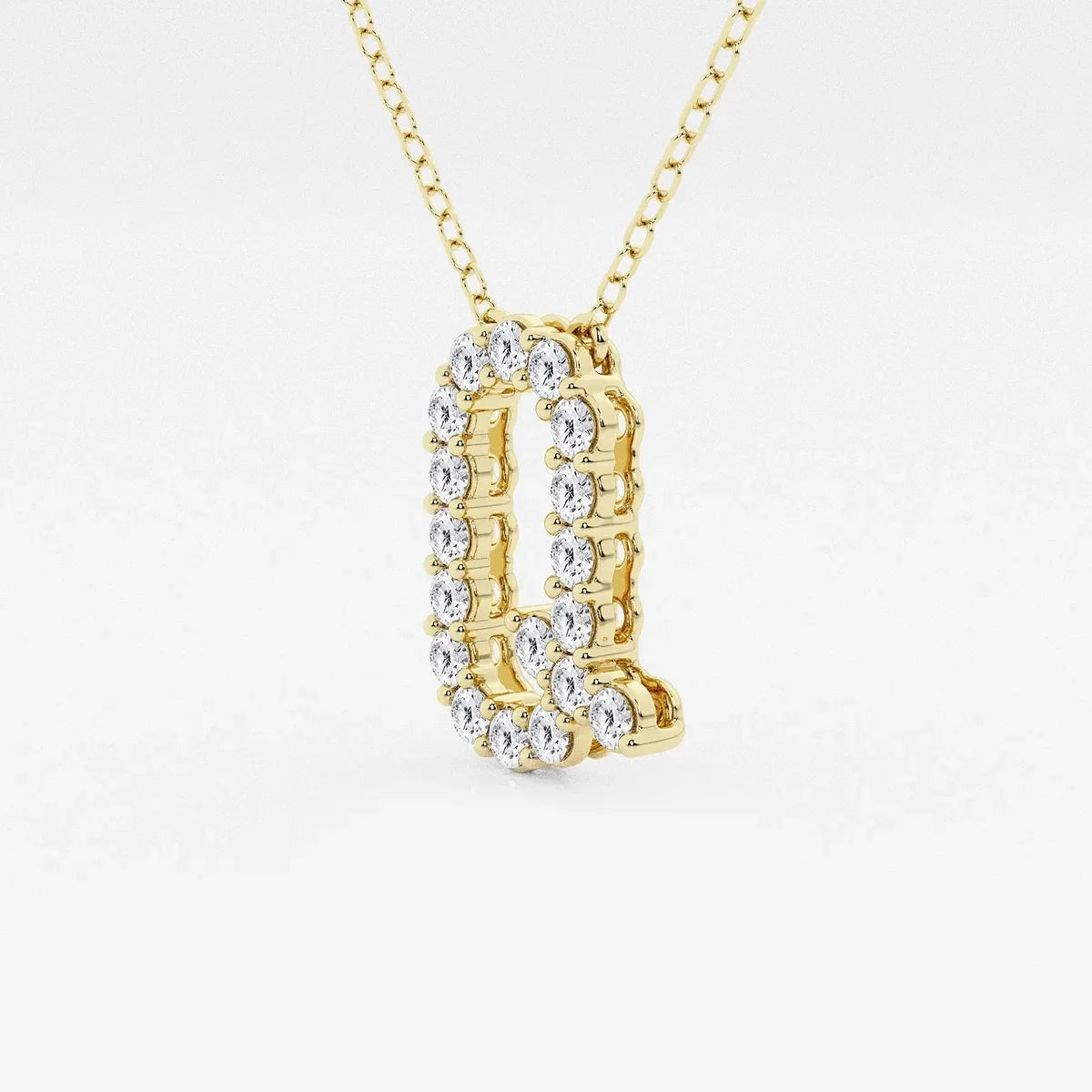 Gold pendant necklace with lab grown diamonds shaped as the letter Q from Delux Jewelry