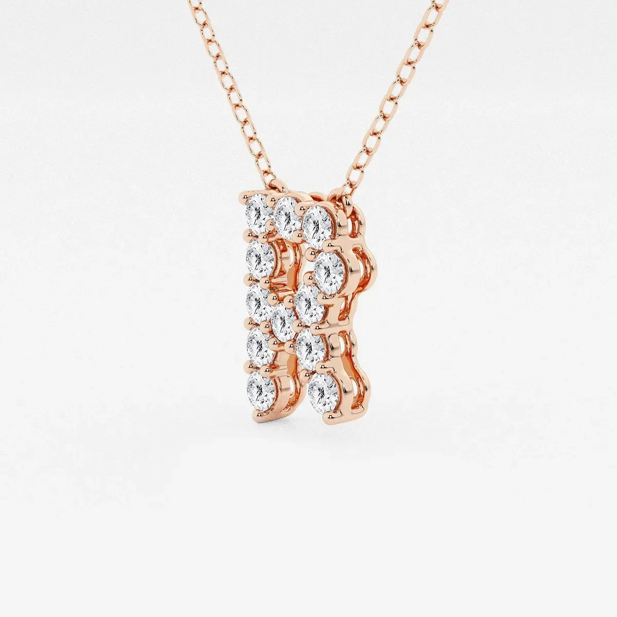 Rose gold pendant necklace with lab grown diamonds in the shape of letter R by Delux Jewelry
