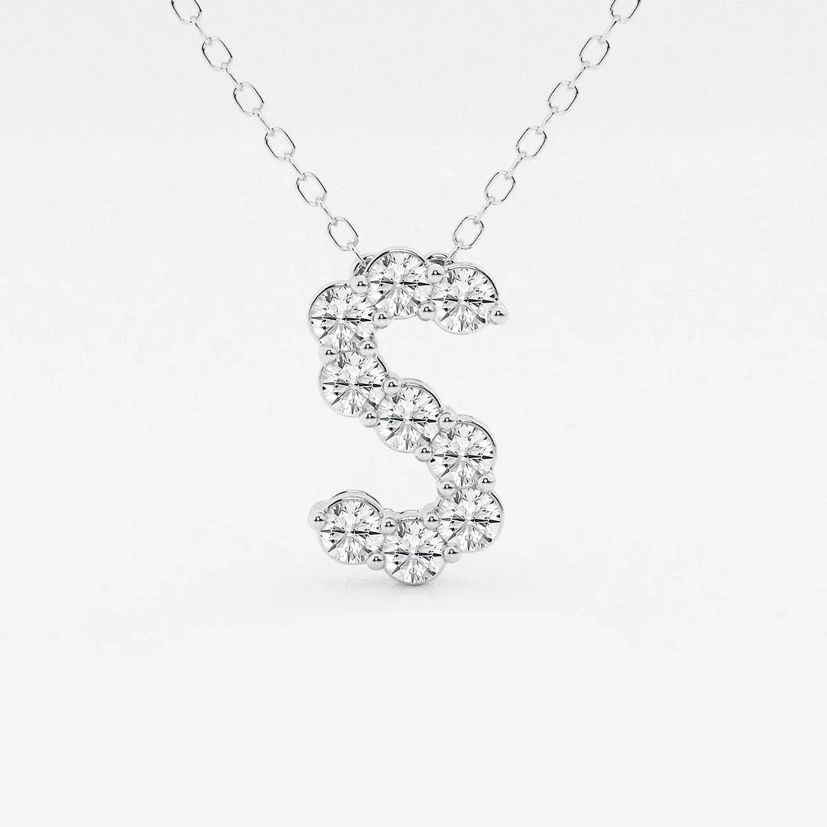 White gold necklace with S-shaped pendant set with lab grown diamonds from Delux Jewelry