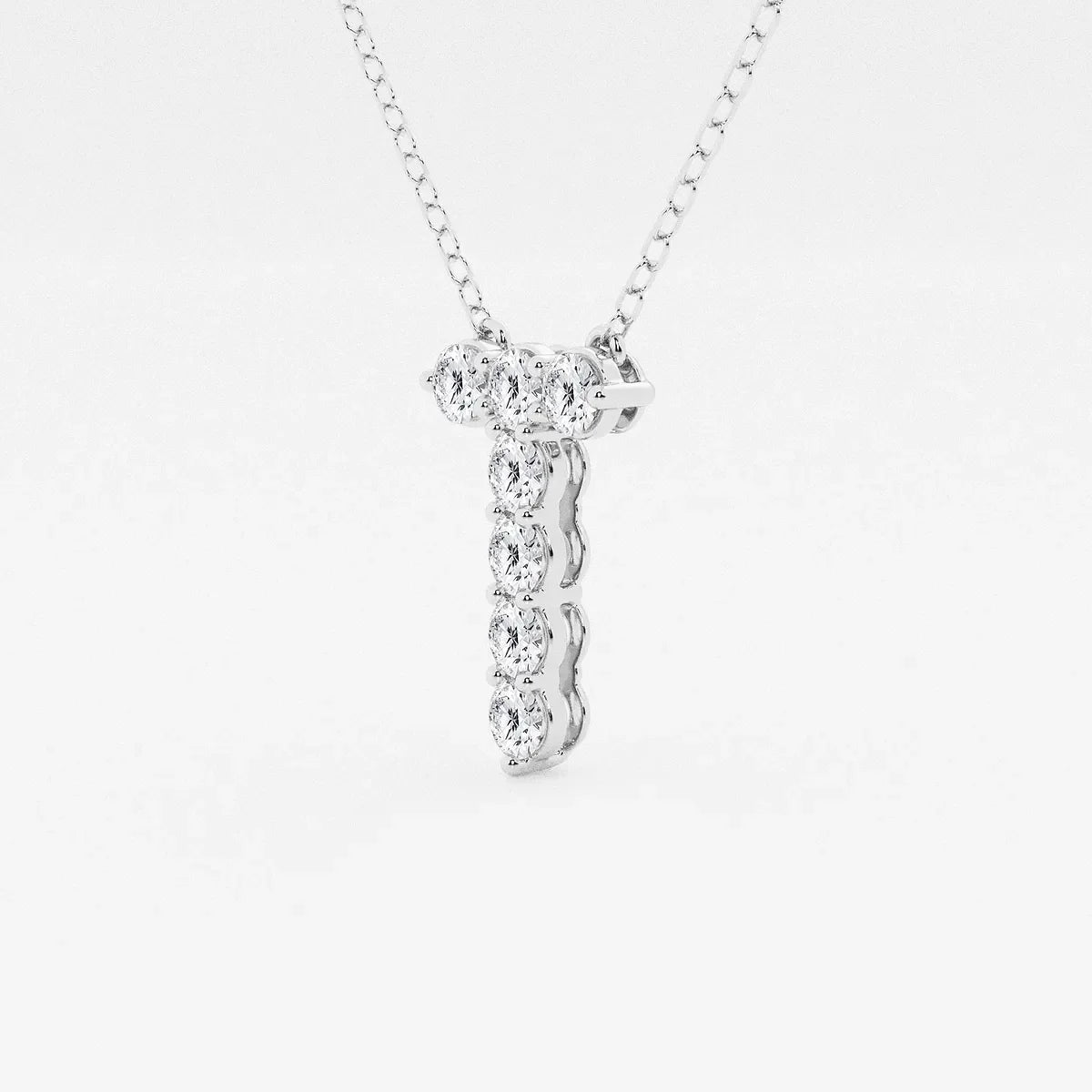White gold pendant necklace with lab grown diamonds from Delux Jewelry on plain background