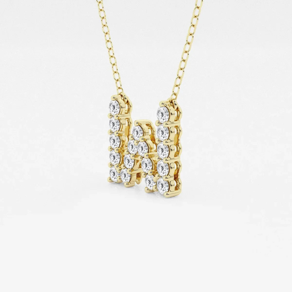 Yellow gold necklace with lab grown diamond letter W pendant on white background