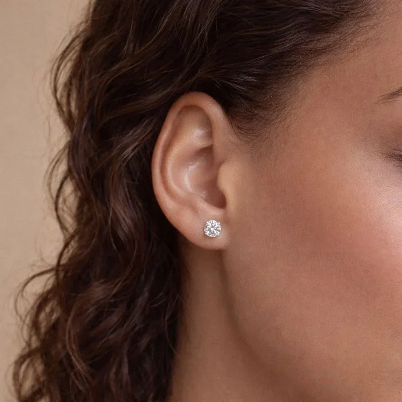 Woman wearing a certified lab grown diamond stud earring by Delux Jewelry