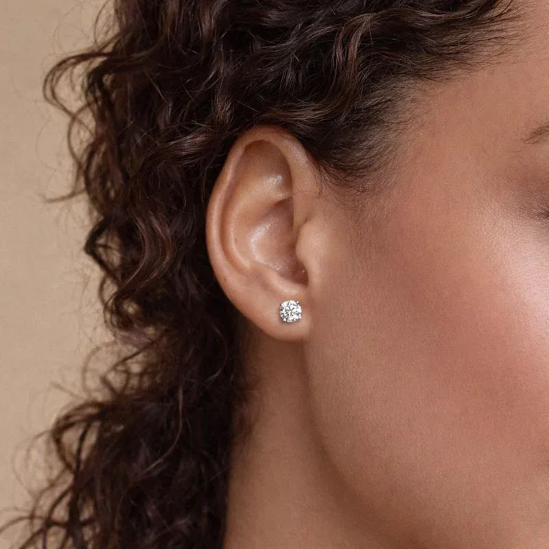 Lab grown diamond stud earring on woman’s ear, fine jewelry by Delux Jewelry