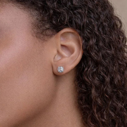 Woman wearing a lab grown diamond stud earring from Delux Jewelry