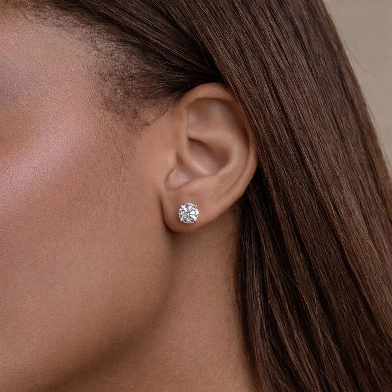 Woman wearing a lab grown diamond stud earring, Delux Jewelry fine jewelry close-up
